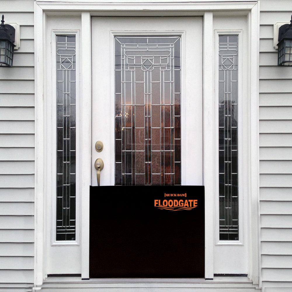 Quick Dam Flood Gate installed at a residential front entry door providing reliable doorway flood protection and home water damage prevention.