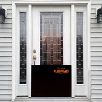 Quick Dam Flood Gate installed at a residential front entry door providing reliable doorway flood protection and home water damage prevention.