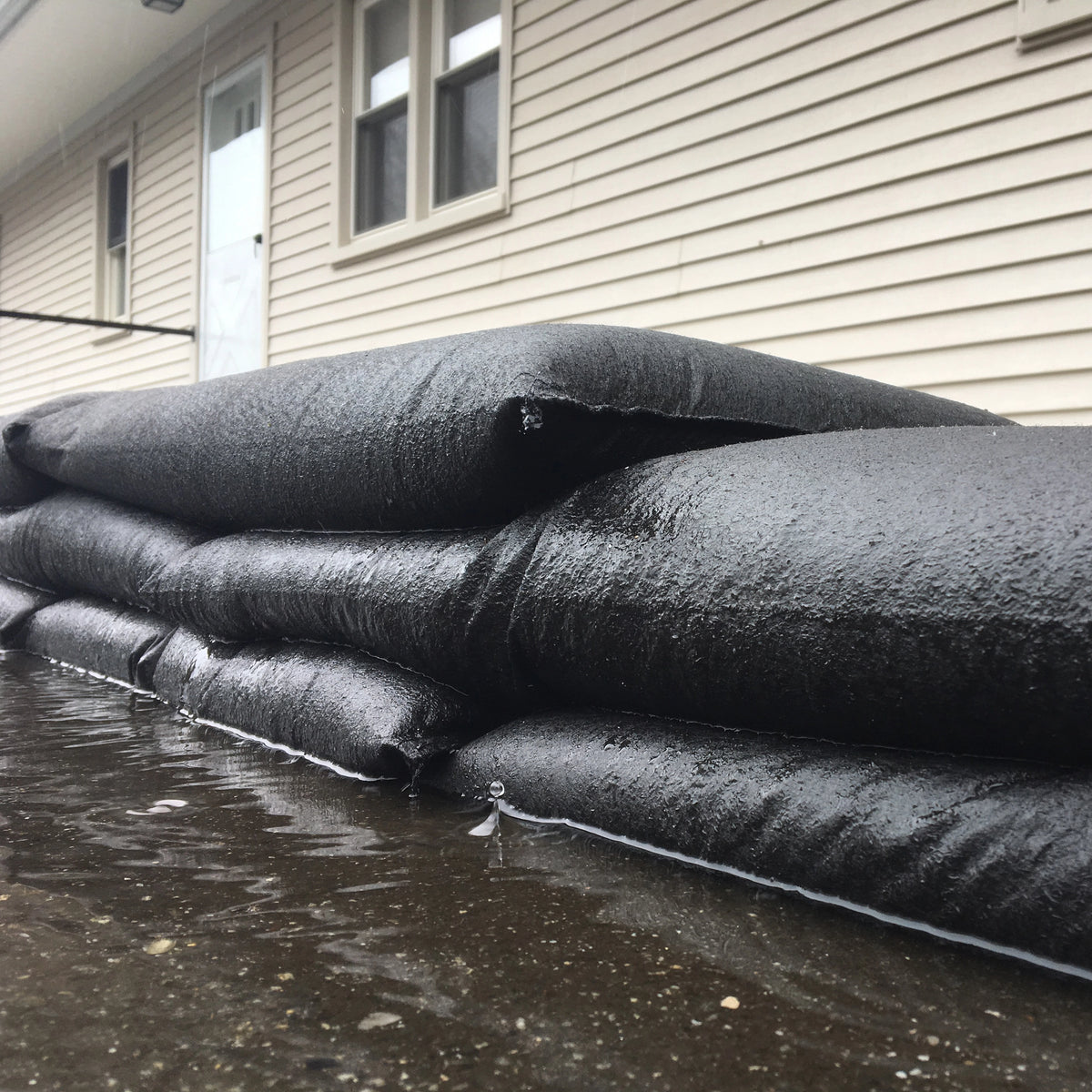 Close up of Quick Dam Flood Bag fabric designed to absorb and retain water for durable reusable flood protection.