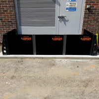 Quick Dam Flood Gates installed in front of an industrial building doorway creating a strong barrier to prevent flood water from entering.
