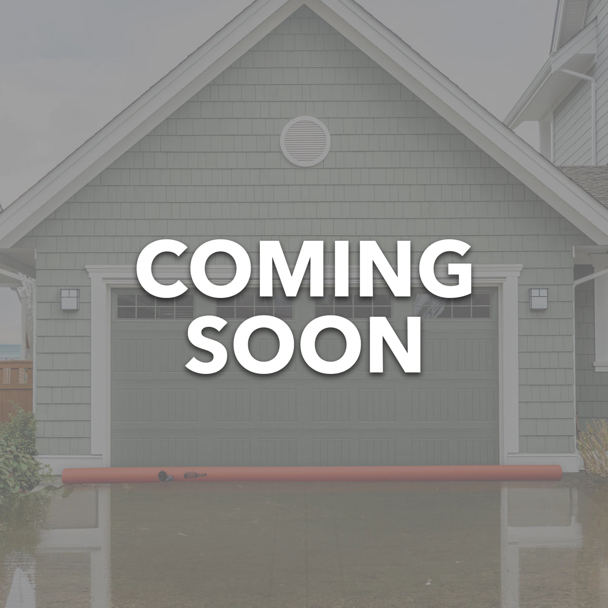 Log Dam COMING SOON displayed in front of a house with flood prevention measures