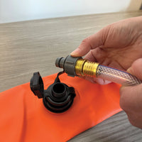 Hand connecting hose to Log Dam (COMING SOON) for efficient water management.