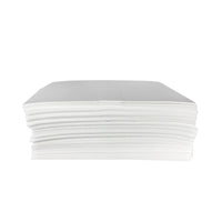 Fifty Mighty Mat absorbent mats on a white background