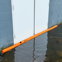 Log Dam COMING SOON placed at a door protecting against floodwater intrusion.