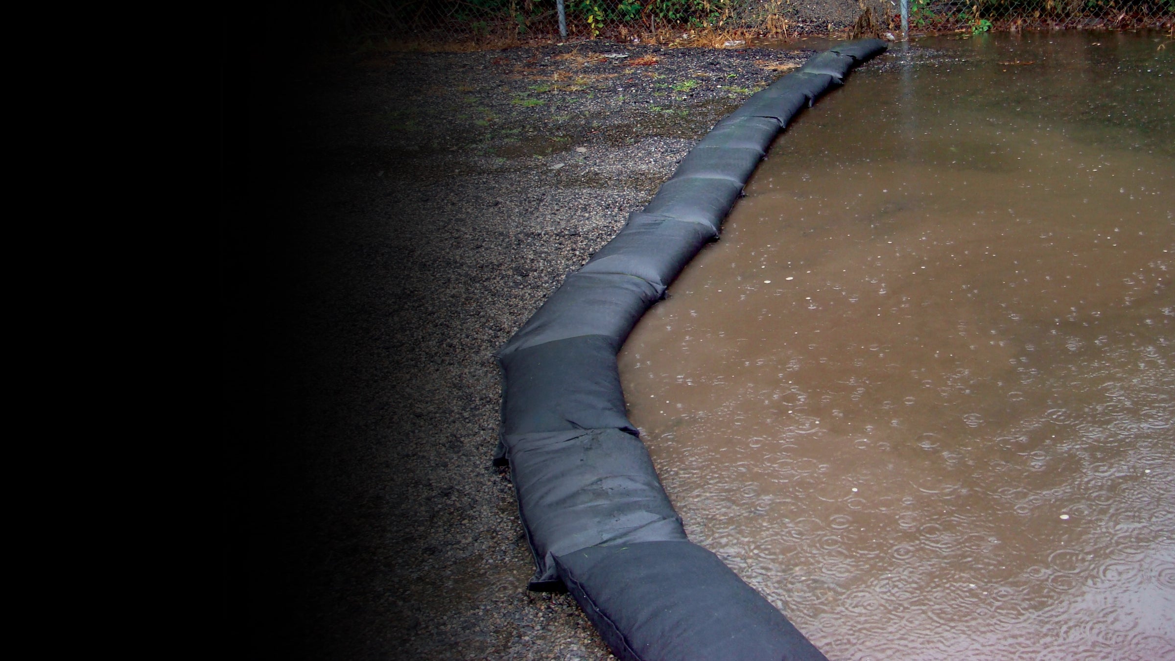 Flood bags lined up holding back flood water