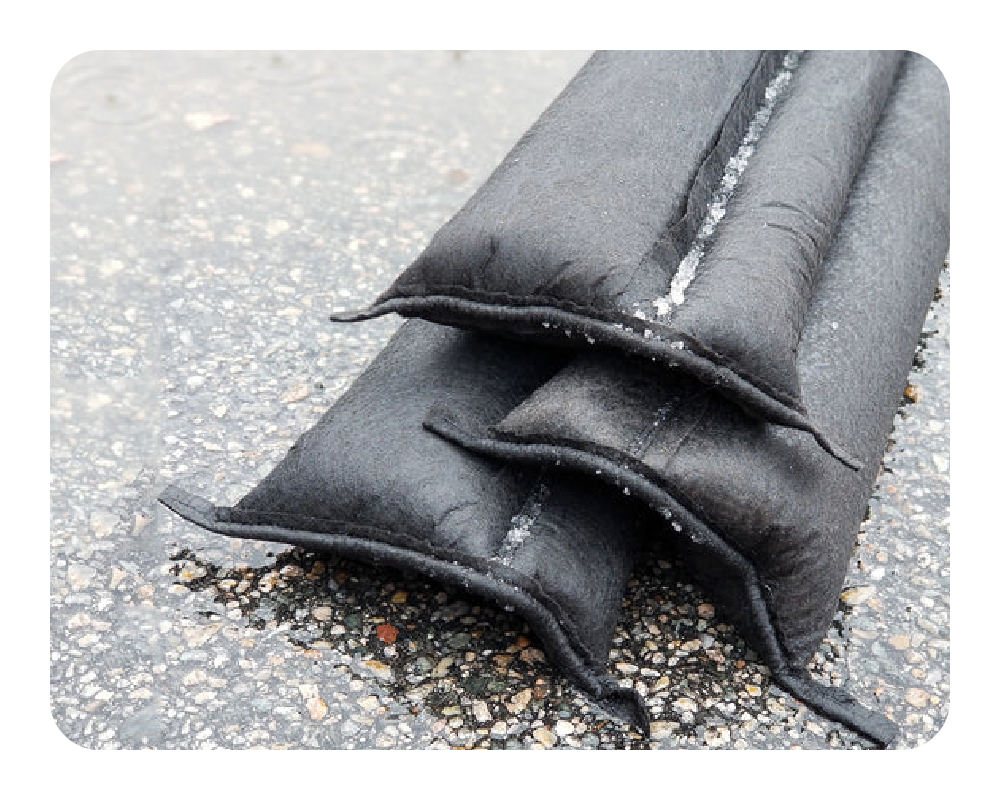 Water activated black Flood Barriers stacked 