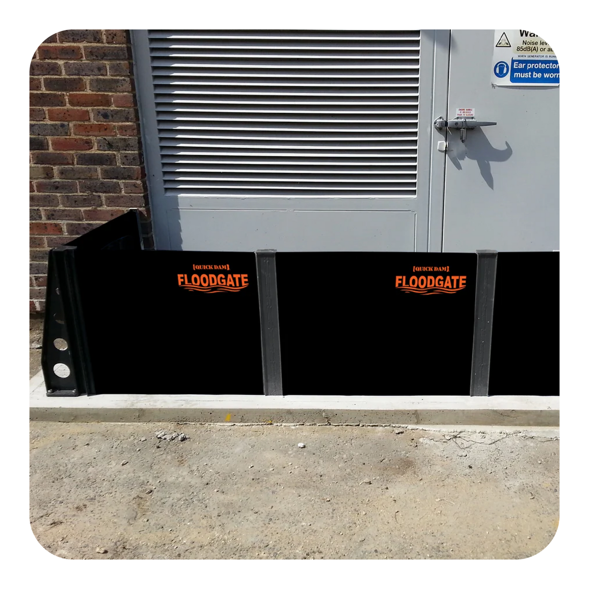 Flood Gate Stanchion installed in front of industrial building