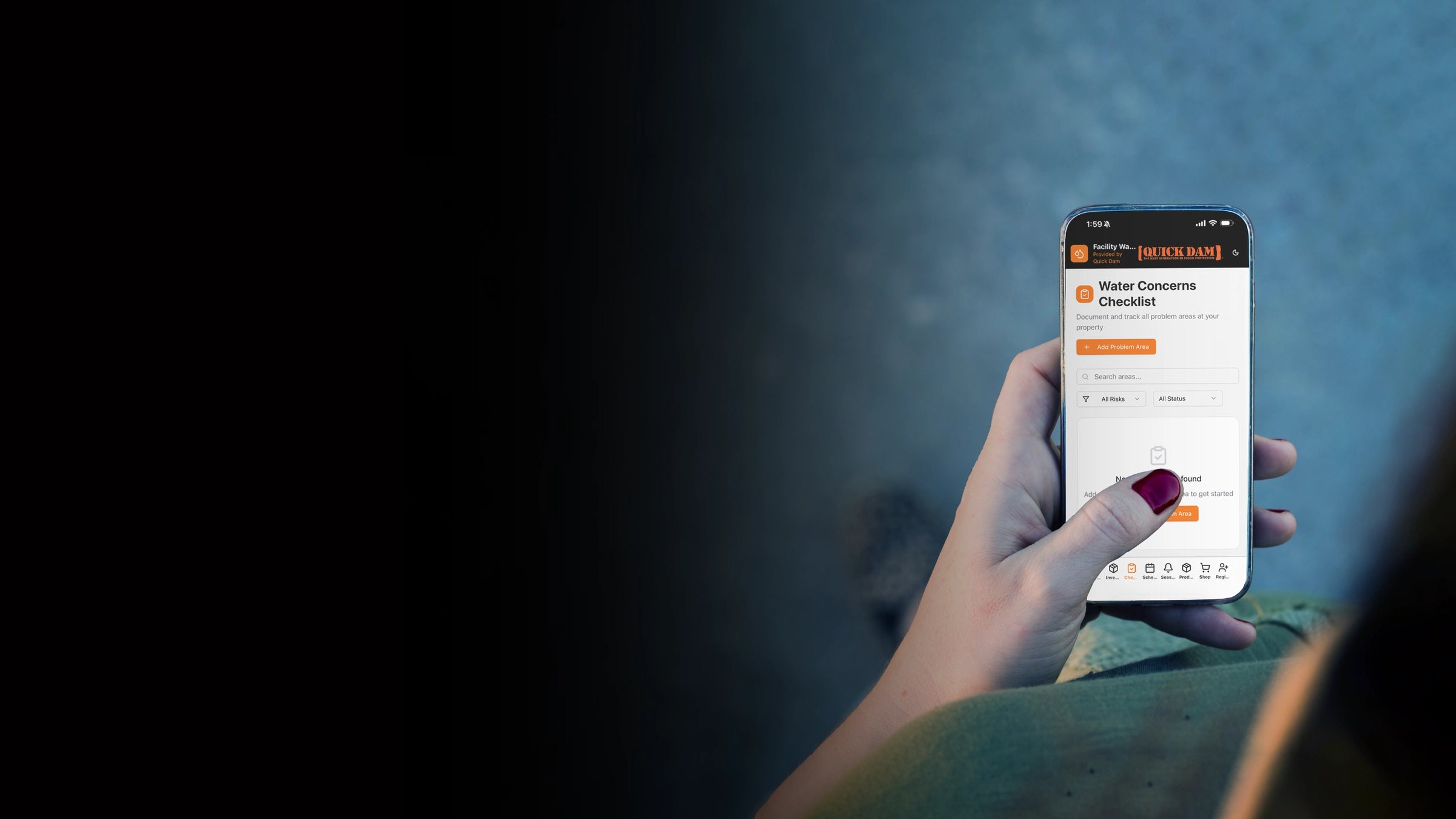 Person holding a smartphone with an app open on a dark background