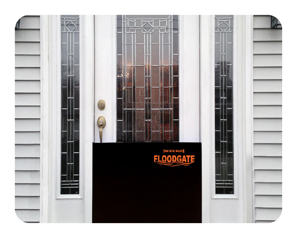White door with glass panels and a black 'Floodgate' installed