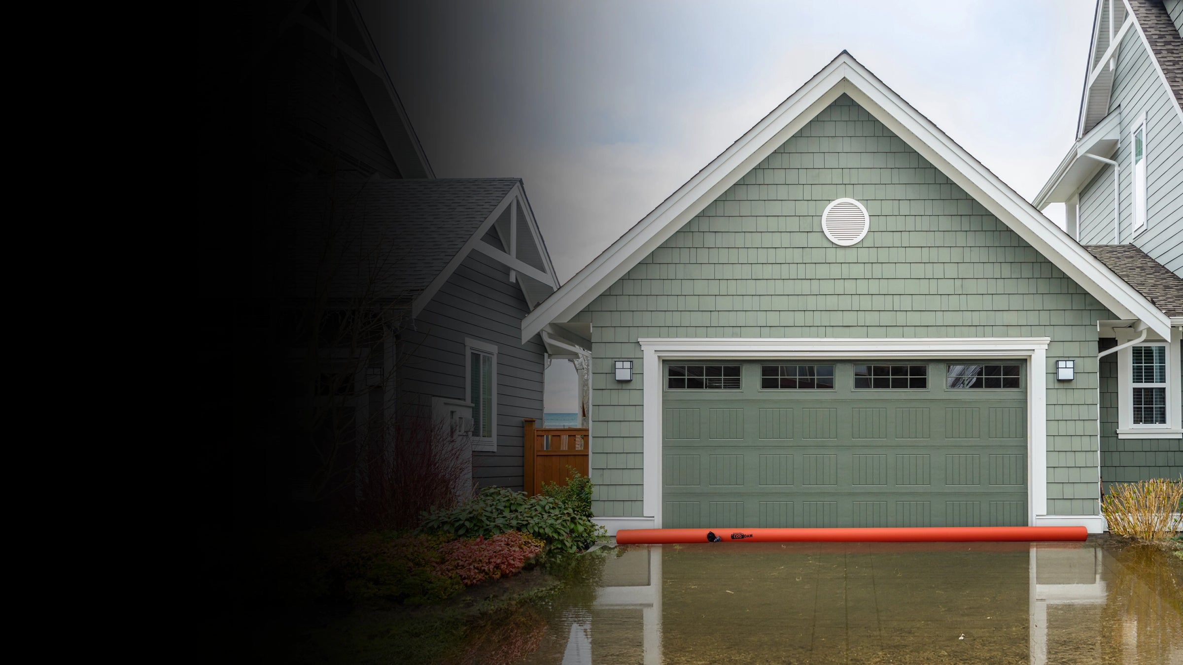 Green garage door on a house with water flooding the area around it