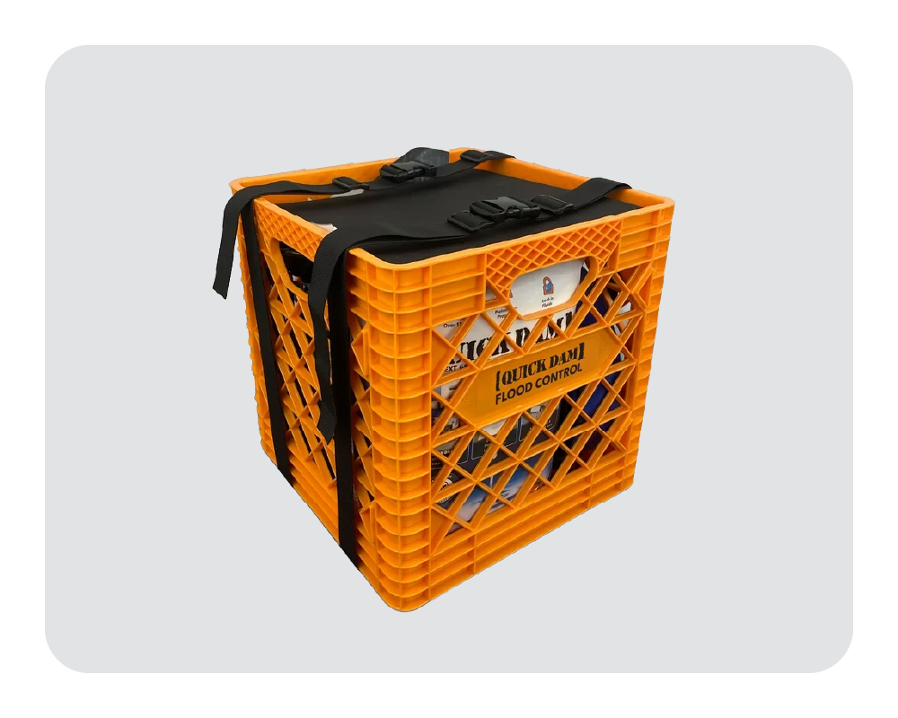 Quick Dam orange crate with black straps on a light gray background