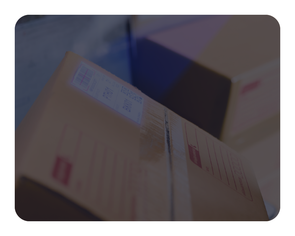 Close-up of a cardboard box with shipping labels on a blurred background