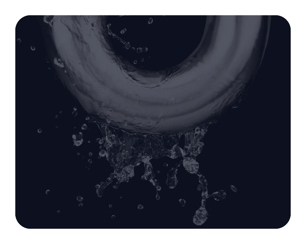 Close-up of water splashing into a sink drain on a dark background